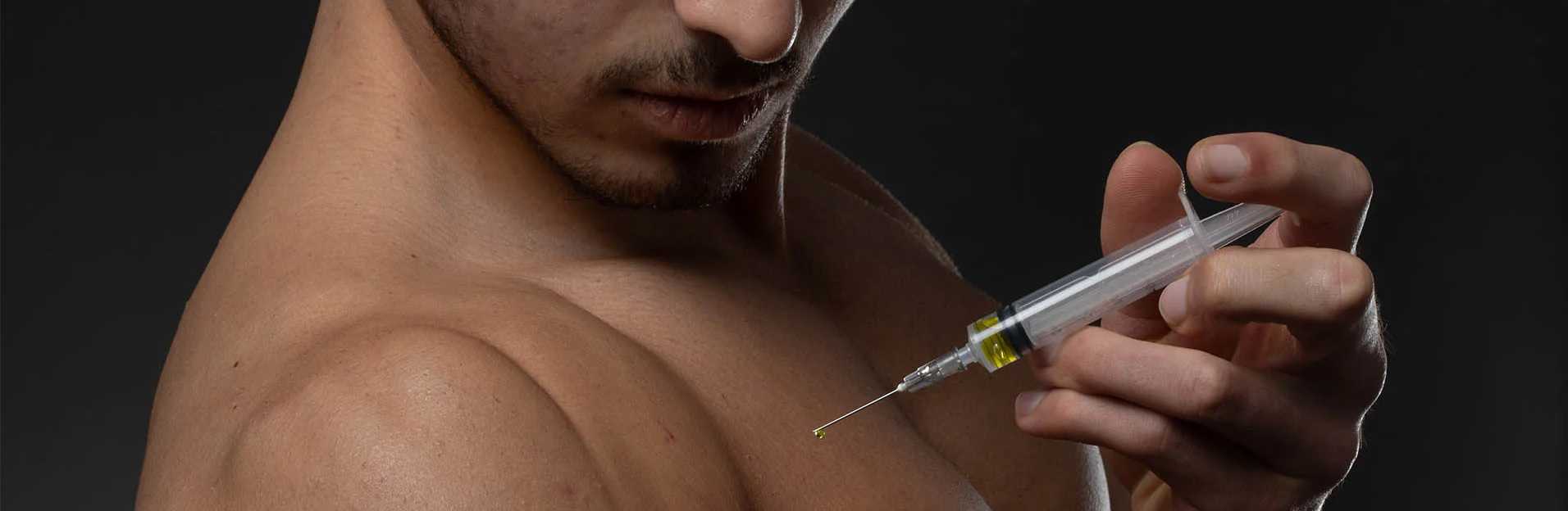 Man injecting steroids